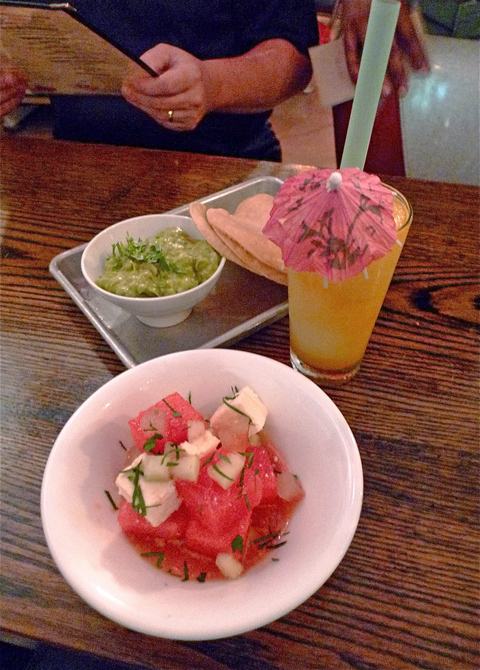 Watermelon salad and chunky guac with passion fruit margarita. Photo: Steven Richter